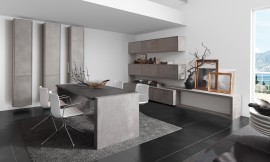 Uitbreiding van de keuken naar het woonbereik met massief houten en betonnen oppervlakten. De overgang tussen keuken en eetkamer wordt steeds geleidelijker. Het waardevolle binnenwerk van puur hout concurreert met gemak met andere gevestigde meubelfabrikant in het woonsegment. Zuordnung: Stil Design-keukens, Planungsart Open keuken (woonkeuken)